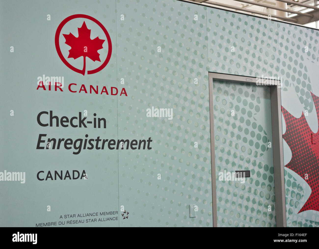 Air Canada Check-in area at Pearson International Airport in Toronto, Ontario Canada.  Sign written in French and English. Stock Photo