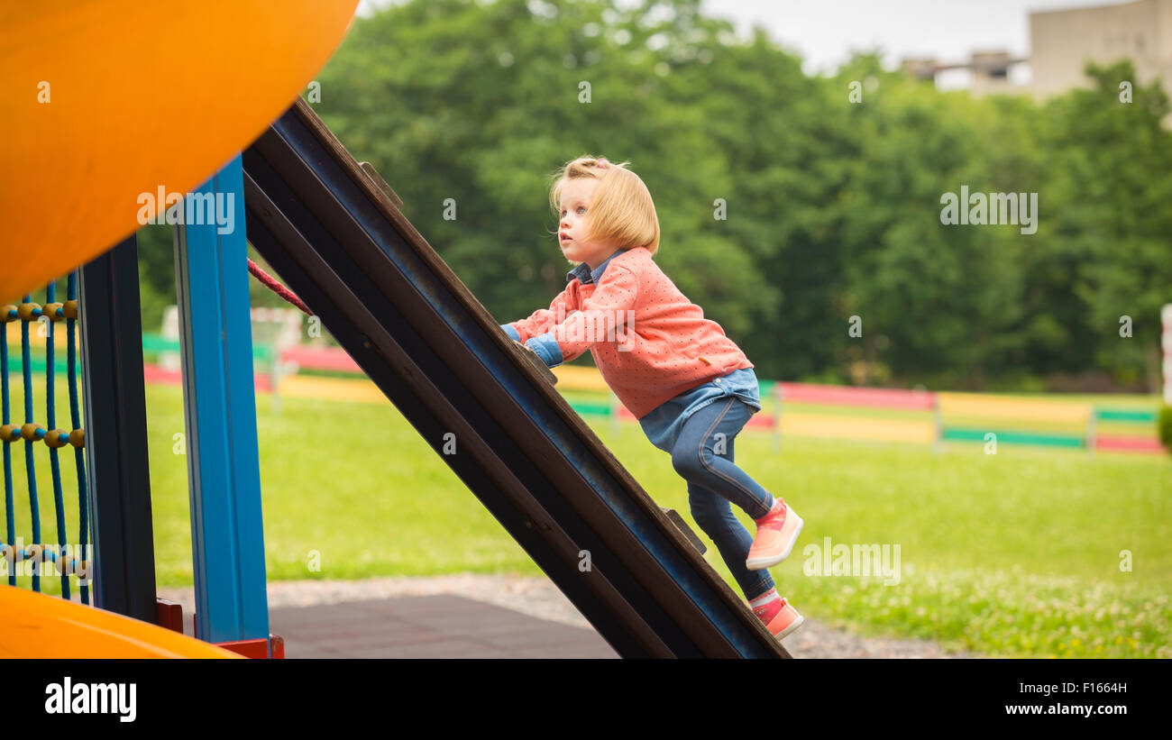 Outdoor portrait of adorable little girl playing in park Stock Photo ...