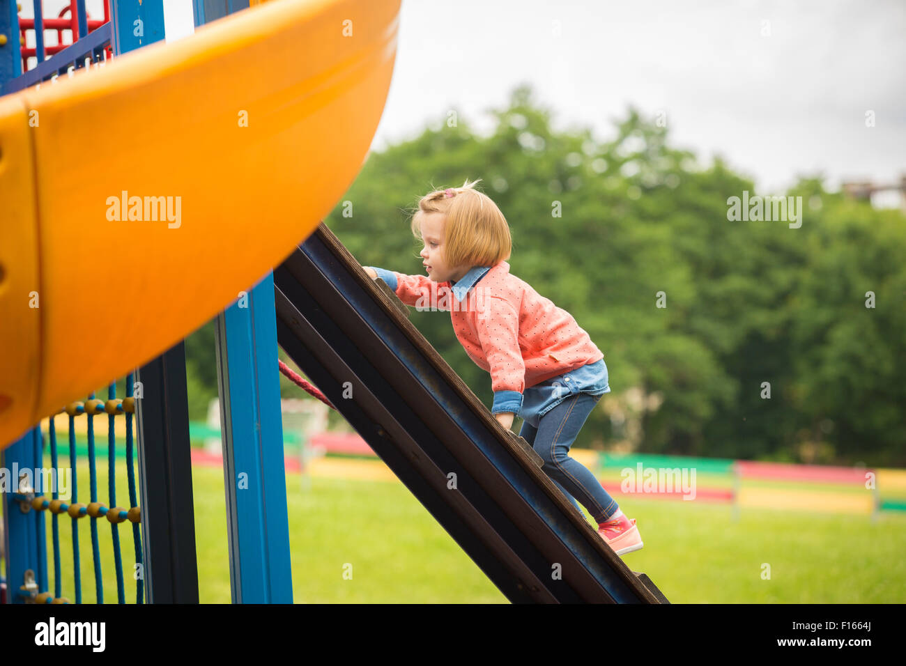 Outdoor portrait of adorable little girl playing in park Stock Photo ...