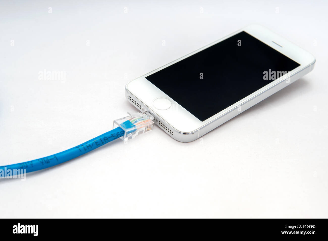 smartphone with ethernet cable Stock Photo