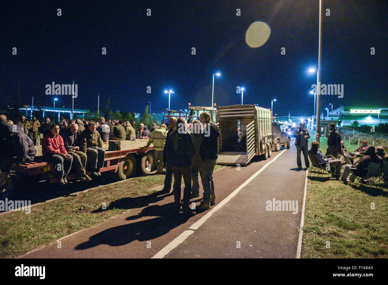 Bridgwater, UK. 27th August, 2015. Dairy farmers chat amongst themselves as they continue to fight for better prices paid for their dairy products outside the Morrisons Bridgwater depot in Somerset. Credit:  Michael Scott/Alamy Live News Stock Photo