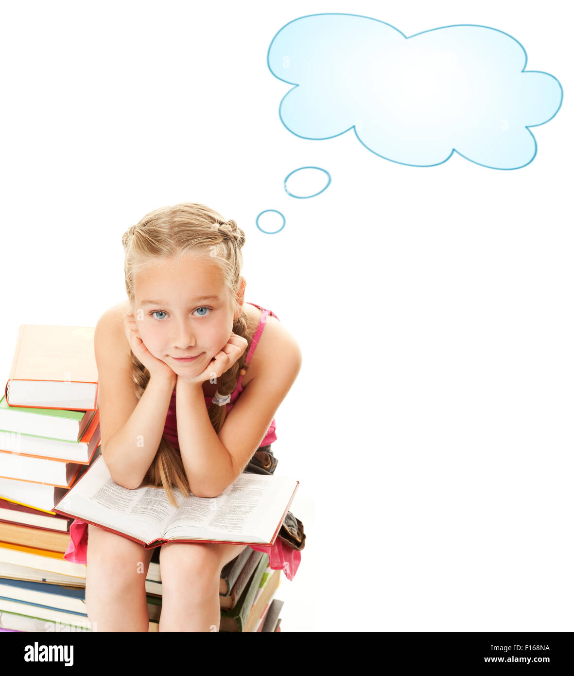 Little schoolgirl sitting on a stack of books Stock Photo - Alamy