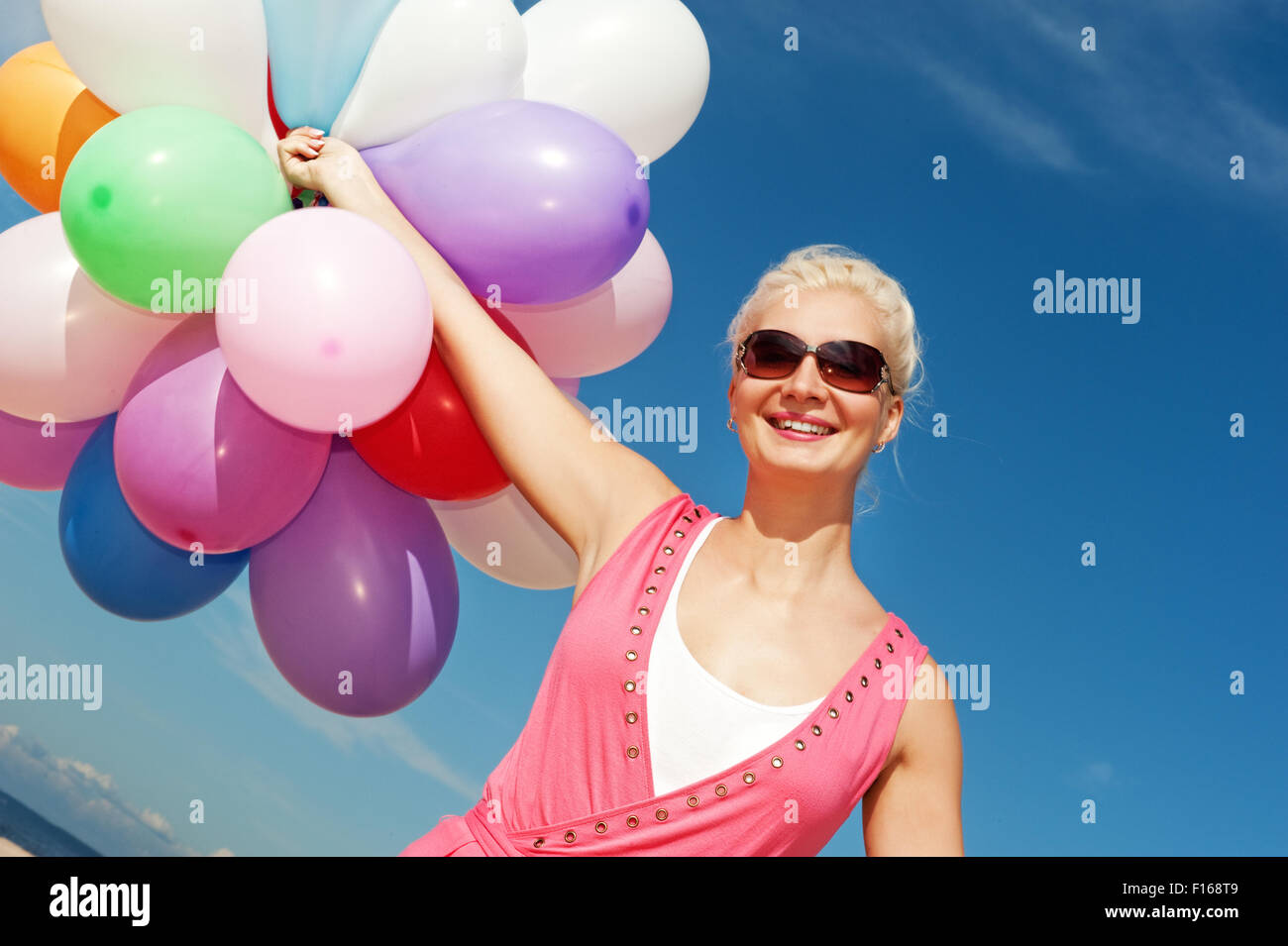 Happy Young Woman With Colorful Balloons Stock Photo Alamy happy-young-woman-with-colorful-balloons-stock-photo-alamy