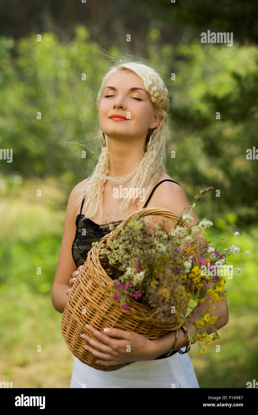 Beautiful woman relaxing outdoors Stock Photo - Alamy