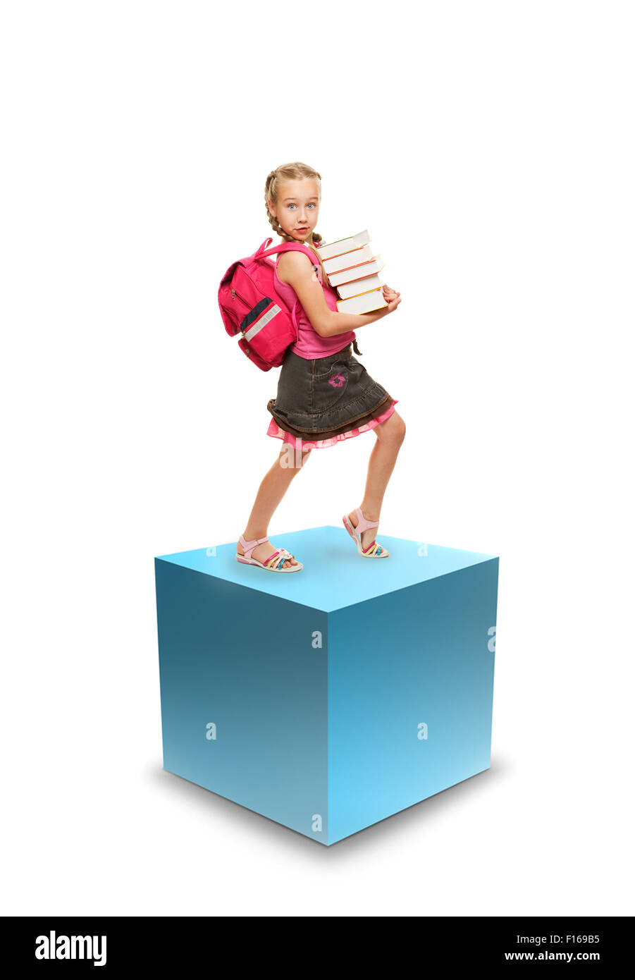 Happy little schoolgirl with a stack of heavy books Stock Photo - Alamy