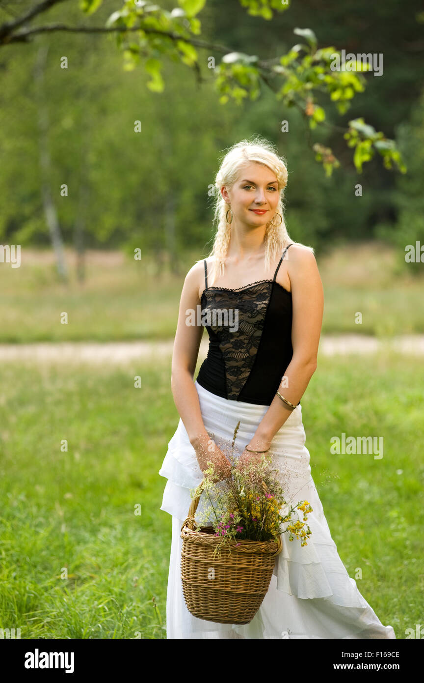 Beautiful woman relaxing outdoors Stock Photo - Alamy