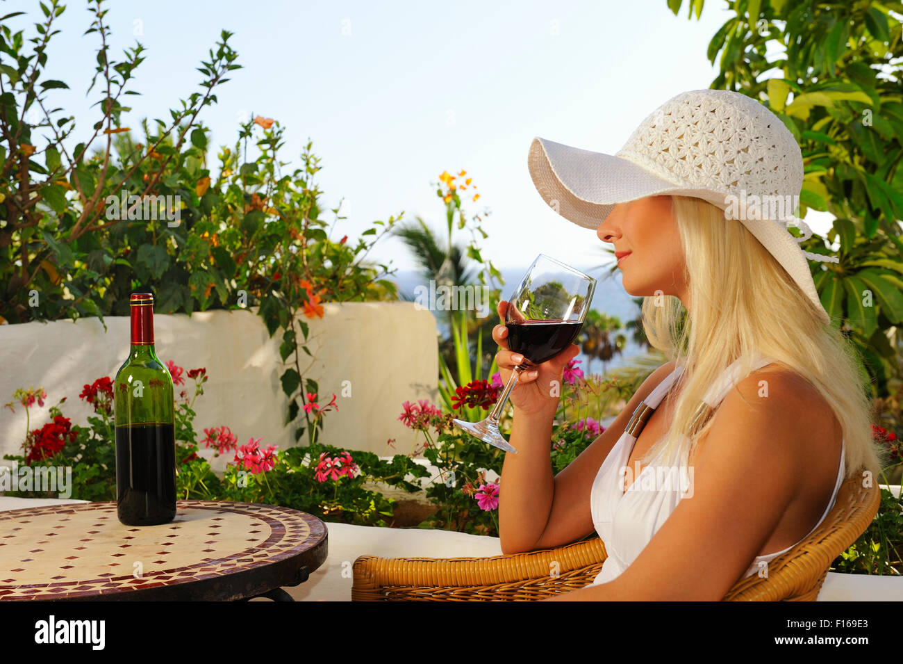 Beautiful woman with a glass of wine Stock Photo - Alamy