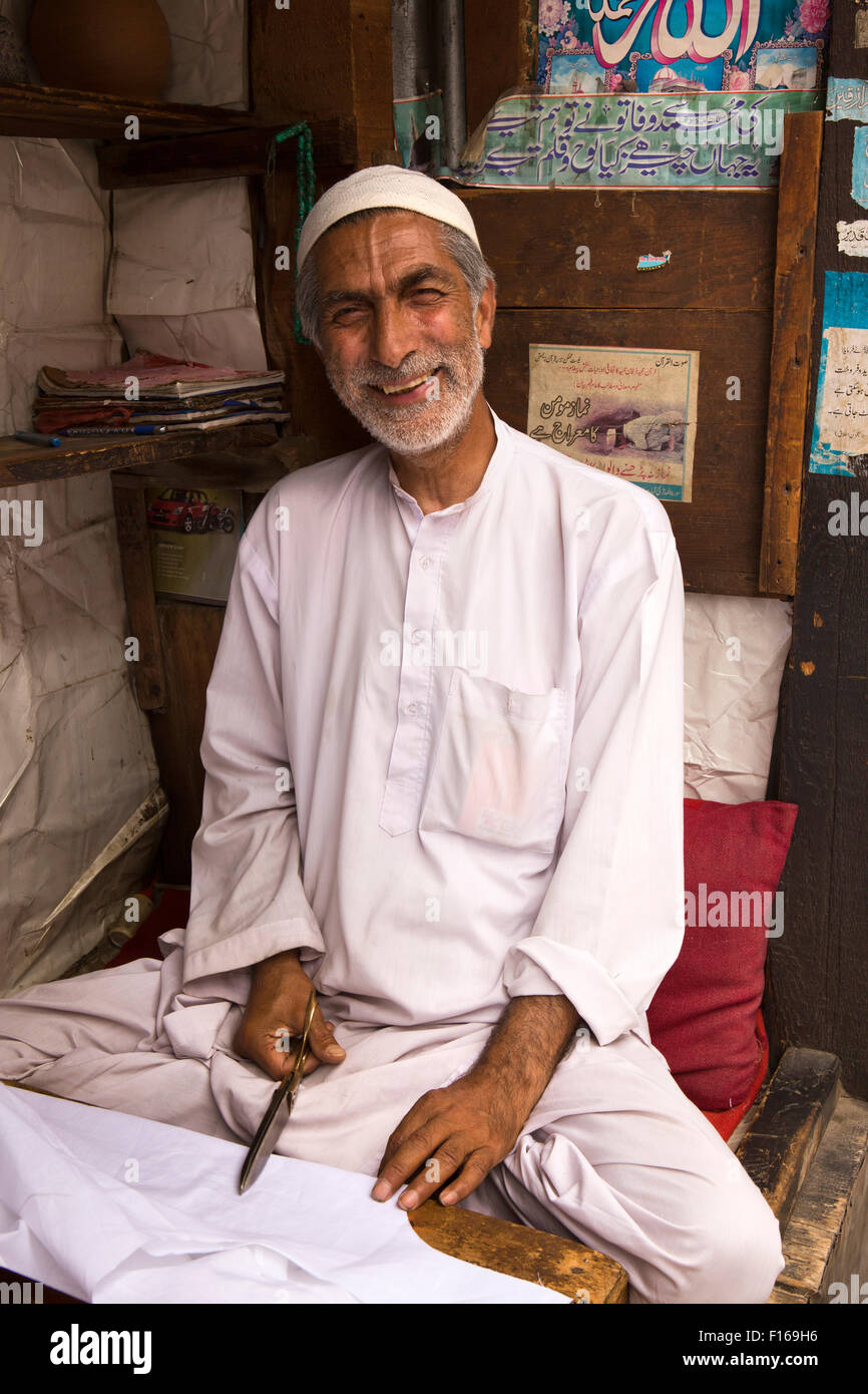 India, Jammu & Kashmir, Srinagar, old city, Sri Ranbir Gunj bazaar, smiling tailor at work Stock Photo