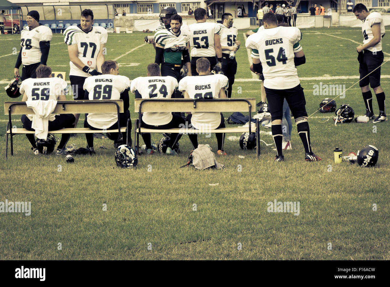 team of American football players on the sideline Stock Photo