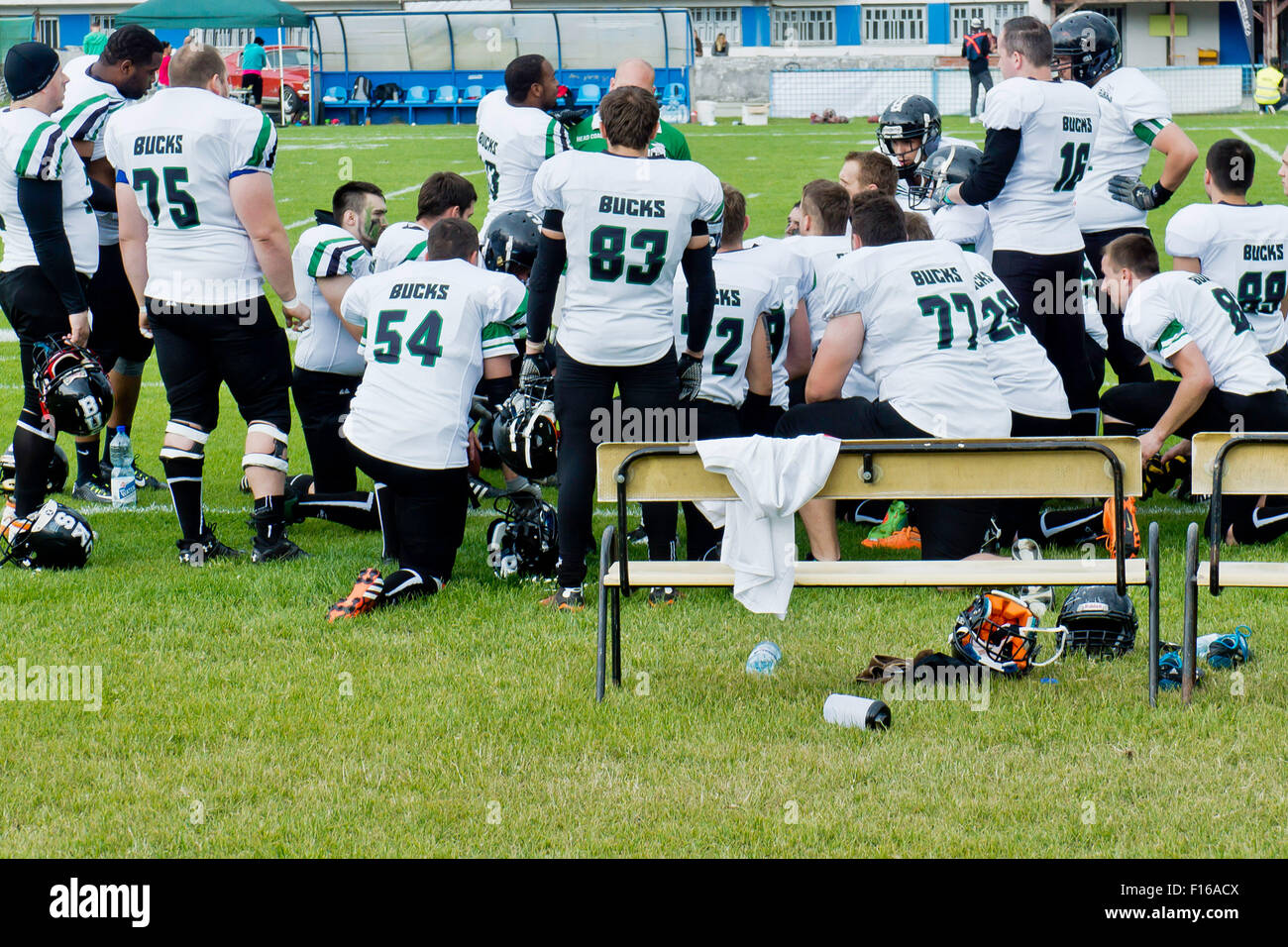 team of American football players on the sideline Stock Photo