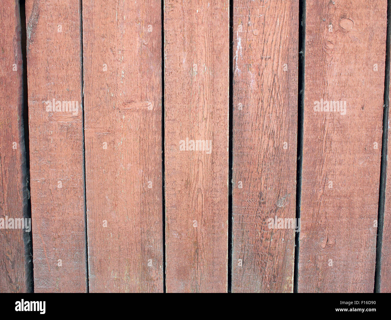 Wood planks closeup with peeling paint brown. Boards make a vertical row and occupy the entire space of the image. Stock Photo