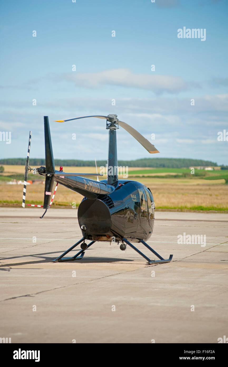 Robinson R44 Raven helicopter (G-MDDT) parked at Inverness airfield Highland Scotland. SCO 10,065. Stock Photo
