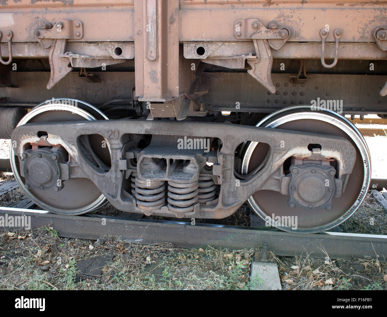 Detail closeup of a railroad car the wheel, the lower part of the car and the track Stock