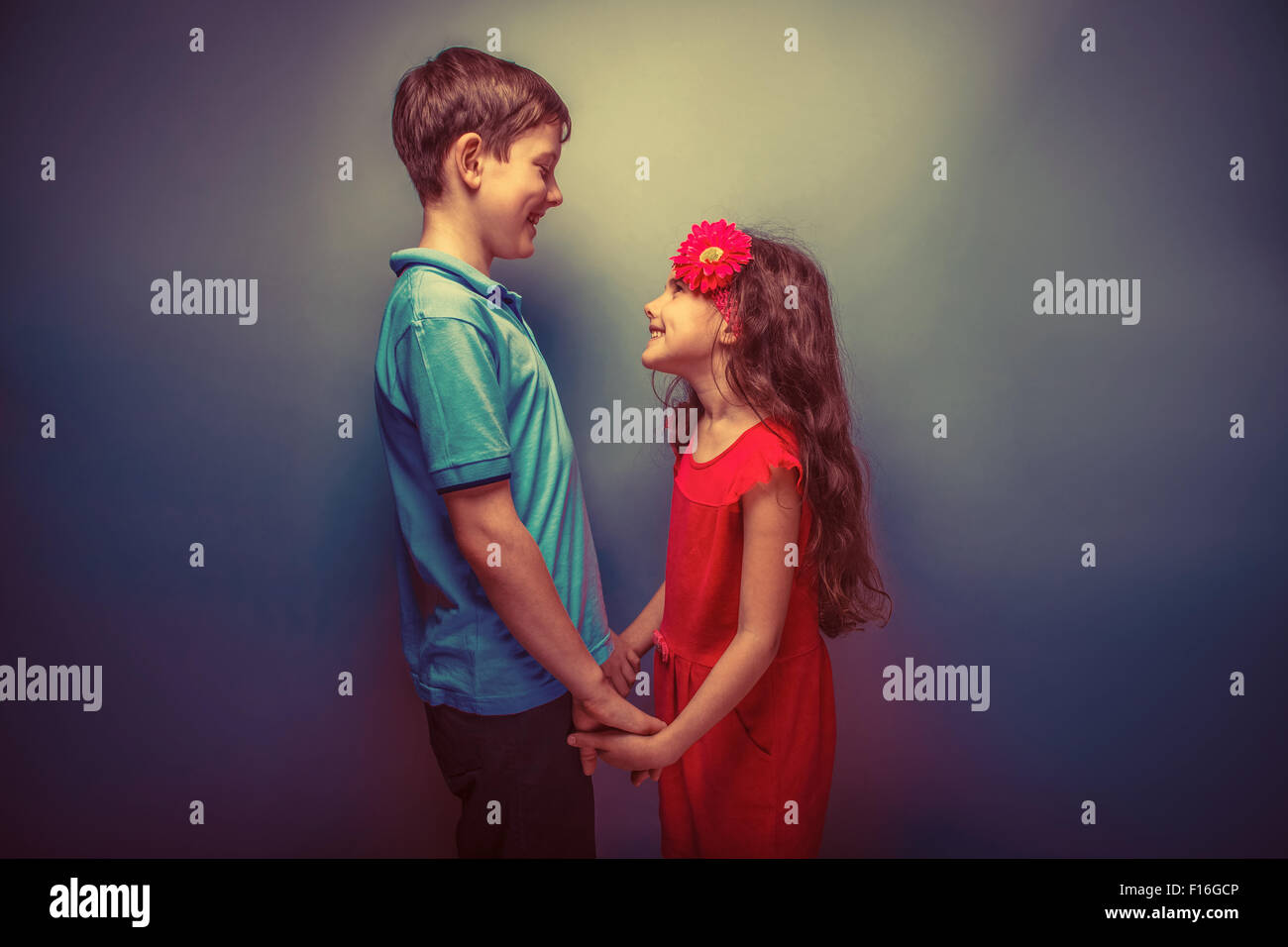 Teenage Boy And Girl Holding Hands