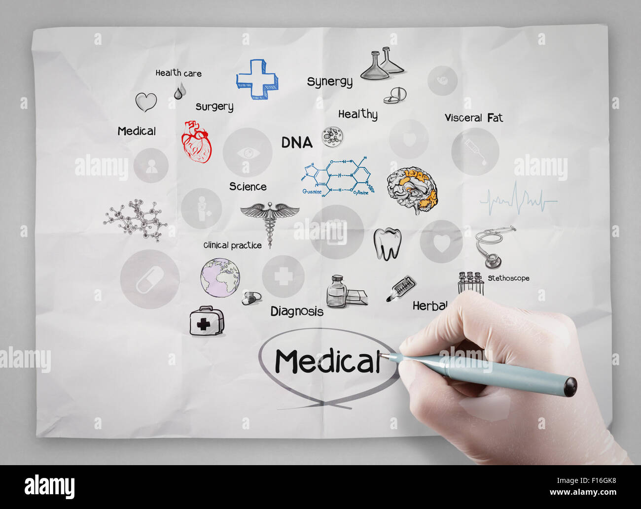 doctor hand draws medical icons on crumpled paper as concept Stock ...
