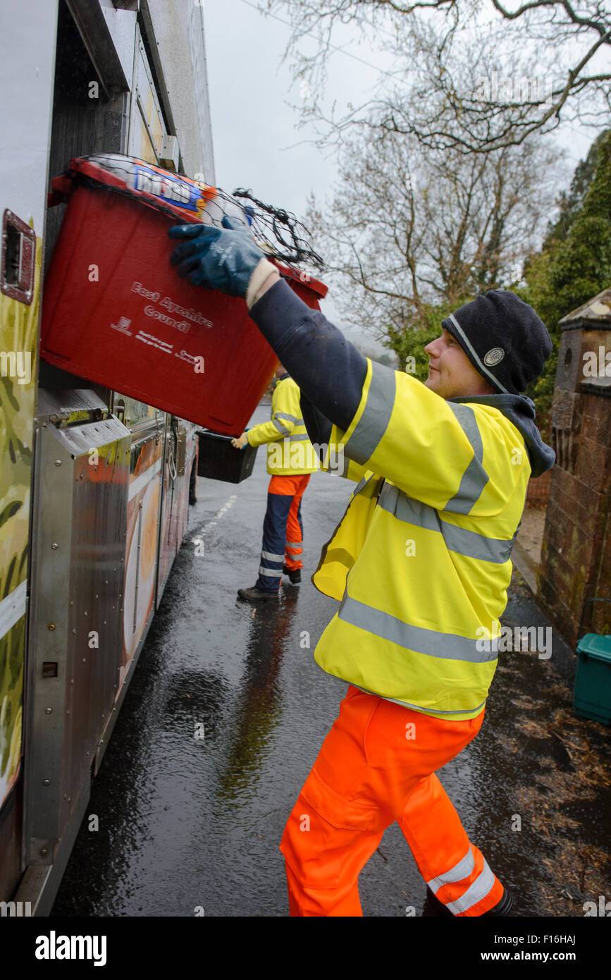 Kerbside recycling collection lorry and workers in rural area Stock