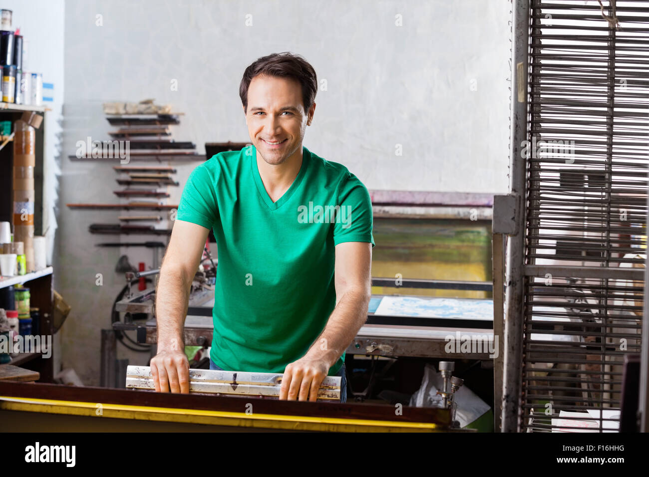 Confident Worker Using Squeegee In Paper Factory Stock Photo Alamy