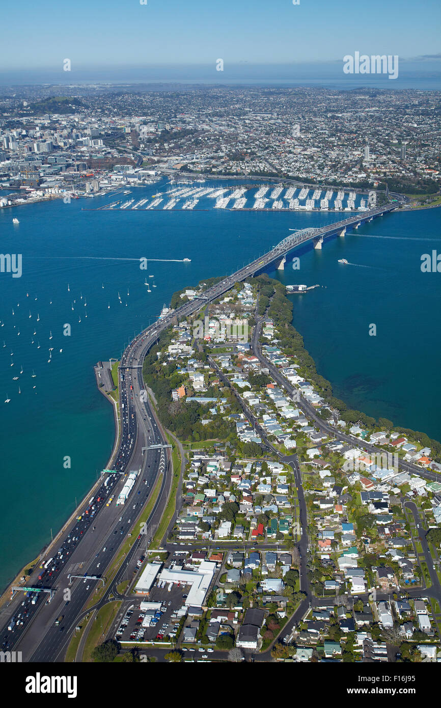 Northcote Point, Auckland Harbour Bridge approach, and Waitemata Harbour, Auckland, North Island, New Zealand - aerial Stock Photo