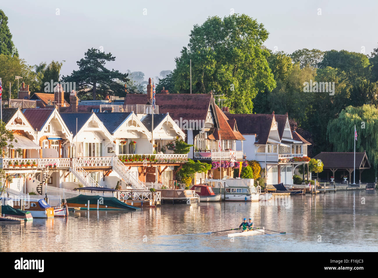 England, Oxfordshire, HenleyonThames, Boathouses and Rowers on River