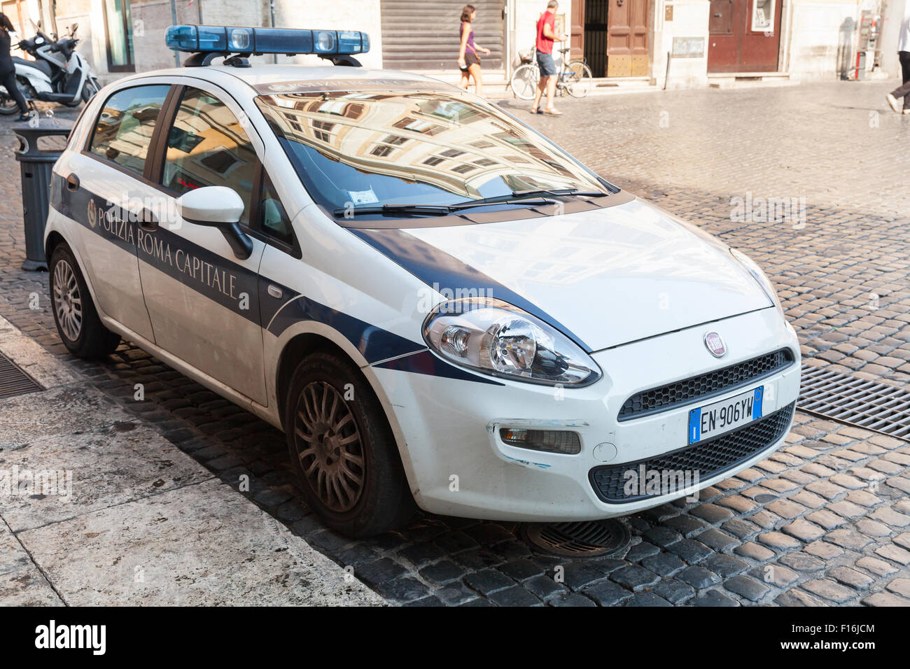 Rome, Italy - August 8, 2015: White Fiat Punto police car stands parked on the city roadside Stock Photo