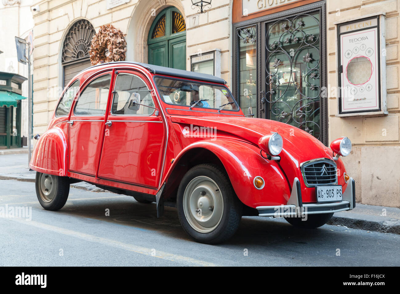 Rome, Italy - August 9, 2015: Red oltimer Citroen 2cv6 Special car stands parked on the city roadside Stock Photo