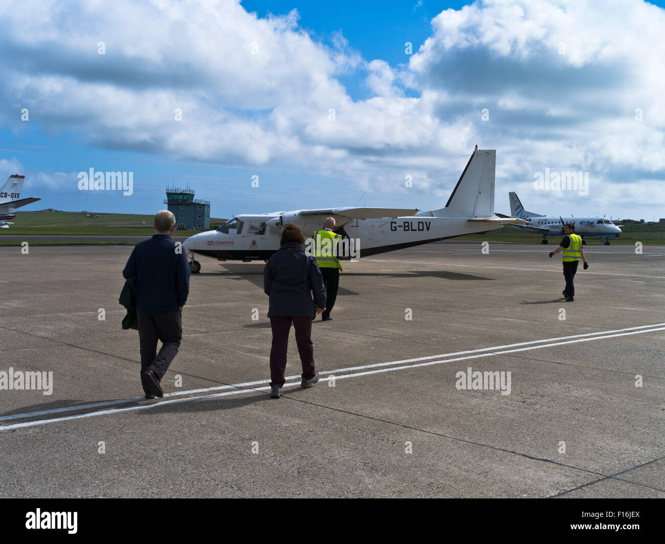 dh Kirkwall airport KIRKWALL ORKNEY Passenagers boarding Loganair Britten-Norman BN2B-26 Islander aeroplane uk Stock Photo