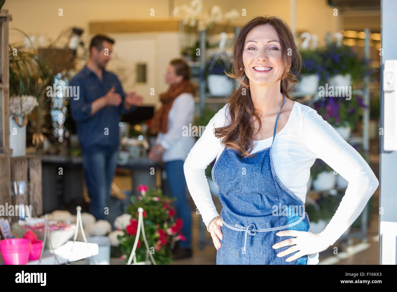 Portrait Of Smiling Female Owner At Flower Shop Stock Photo - Alamy