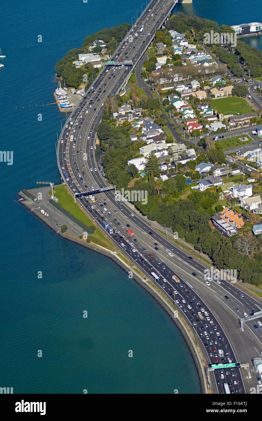 Northcote Point, Auckland Harbour Bridge approach, and Waitemata Harbour, Auckland, North Island, New Zealand - aerial Stock Photo
