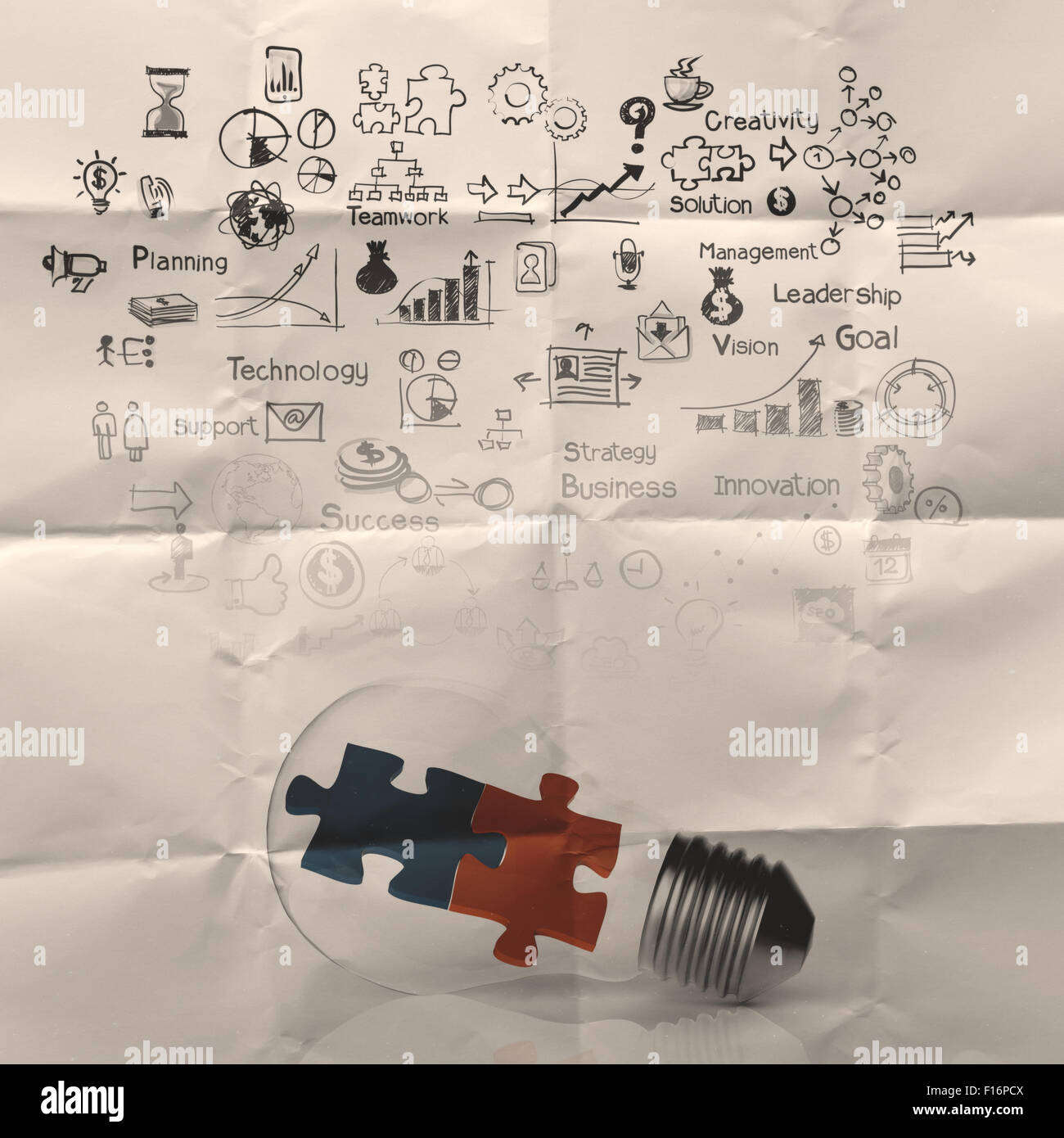 Solotion Pic Light bulb and puzzle piece as ideas and solutions on crumpled paper ...