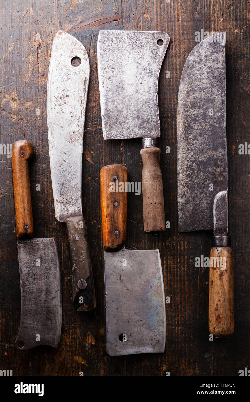 Vintage Butcher meat cleavers on dark wooden background Stock Photo Alamy