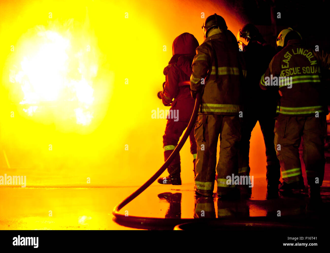 Firefighters Attack A Propane Fire During A Training Exercise Stock ...