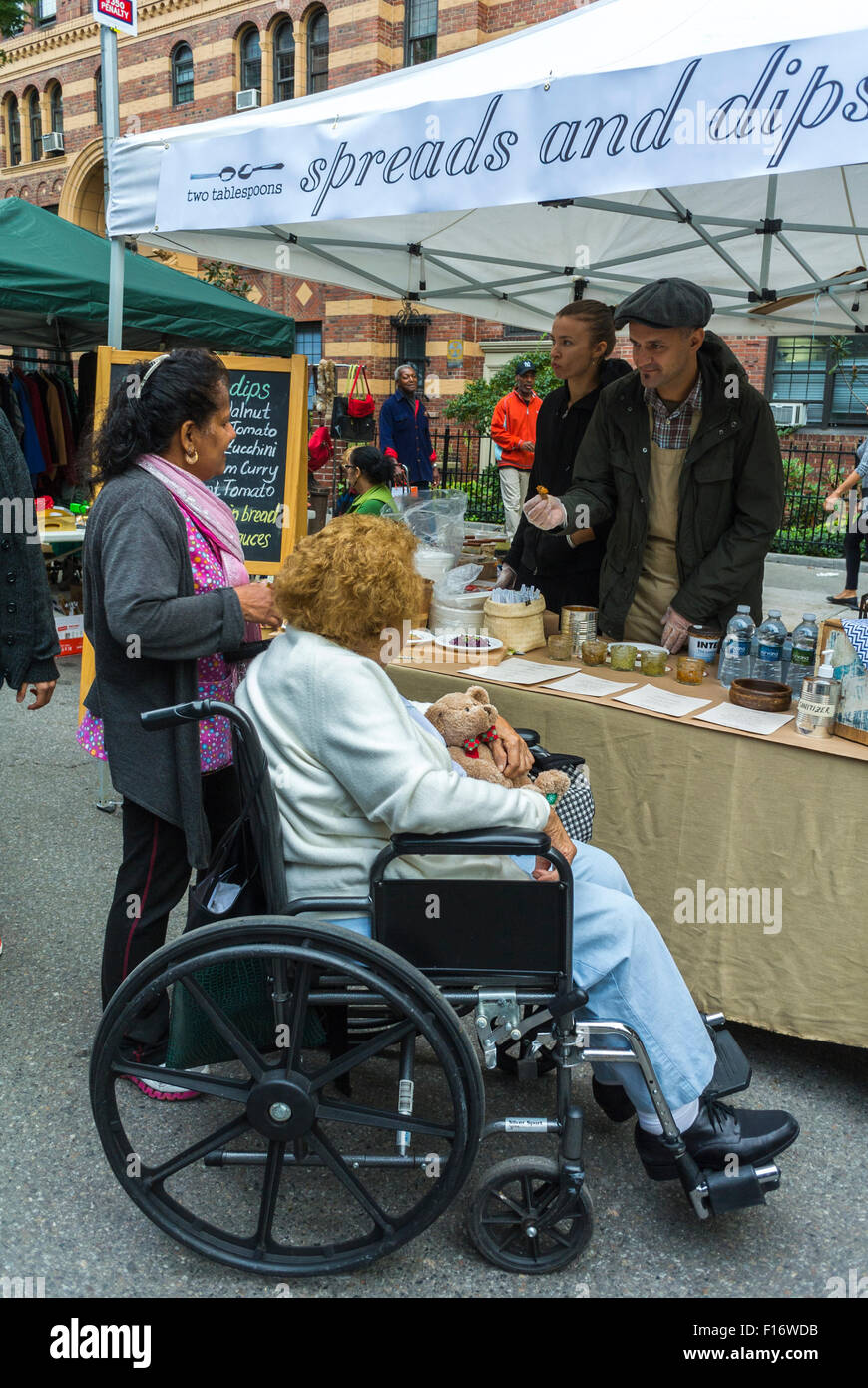 New York City, USA, Handicapped special needs, Senior Woman in Wheelchair, Shopping in Chelsea Street Flea Market, Summer, Street Food Stall 'Spreads and Dips', Street Vendor, social security senior usa Stock Photo