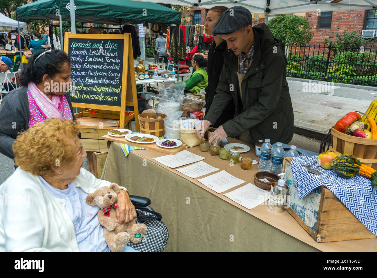 New York City, USA, Handicapped Senior Woman in Wheelchair, Shopping in Chelsea  Flea Market,  Street Food Vendor Stall 'Spreads and Dips' Stock Photo