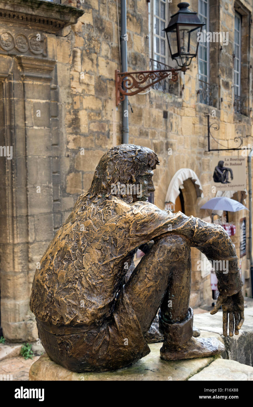 Bronze statue - le Badaud - in Liberty Square, the city centre and marketplace of Sarlat in the Dordogne Stock Photo