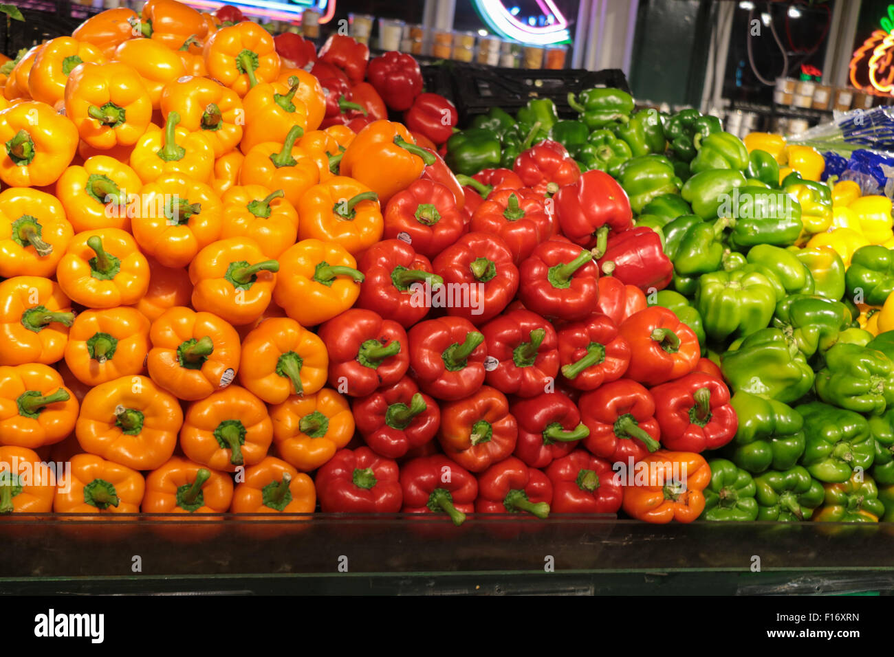 Piles of yellow, red and green sweet peppers in market Stock Photo - Alamy