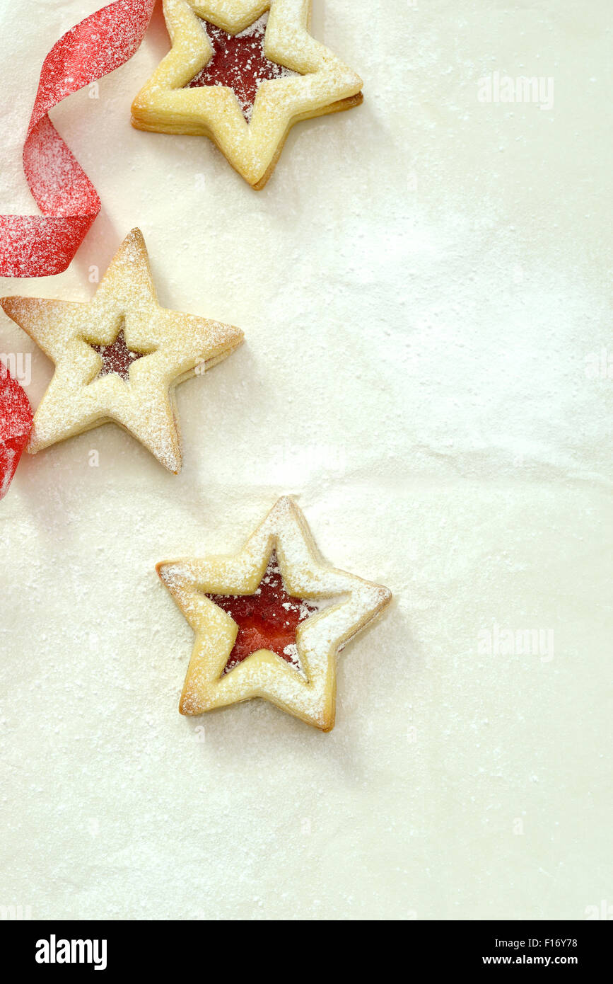 star shaped biscuits with jam filling, dusted in sugar icing Stock