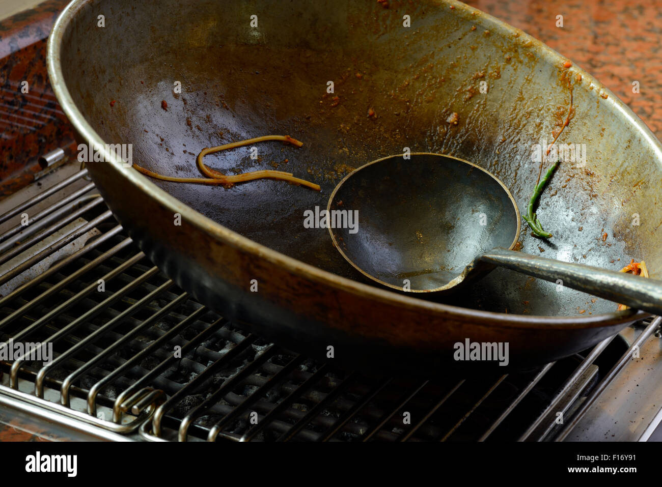 Used wok hi-res stock photography and images - Alamy