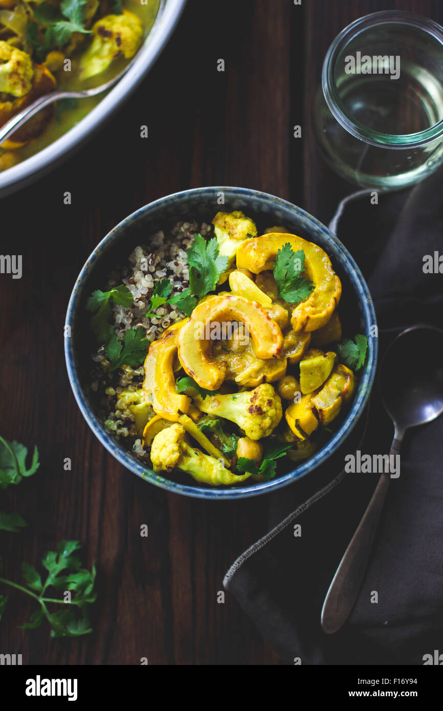 Roasted delicata squash curry with chickpeas and cauliflower. Stock Photo