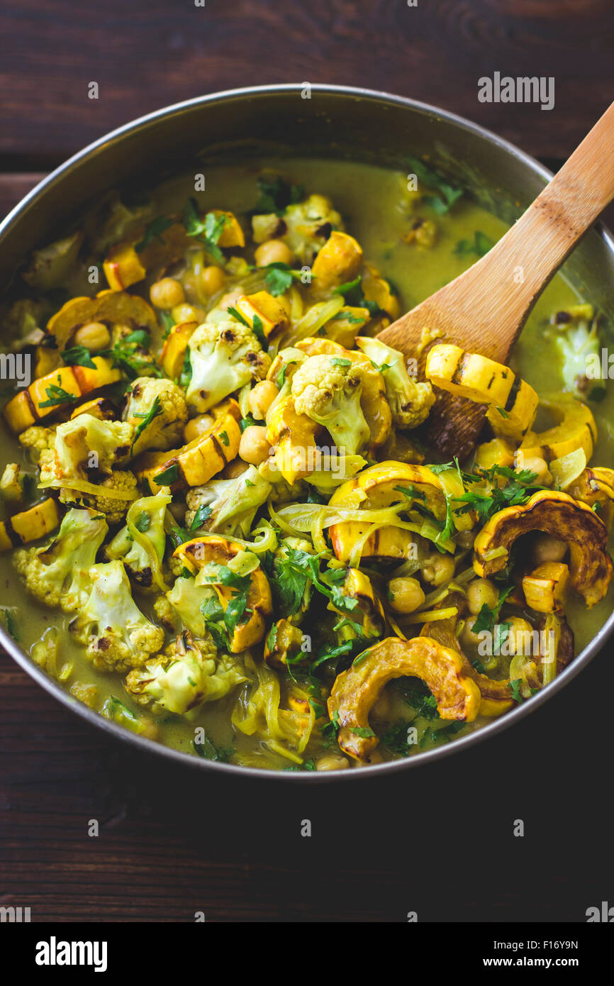 Roasted delicata squash curry with chickpeas and cauliflower. Stock Photo