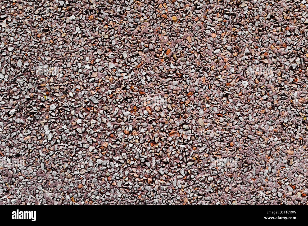 background made of a closeup of a wall plastered with a dry dash aggregates coating Stock Photo