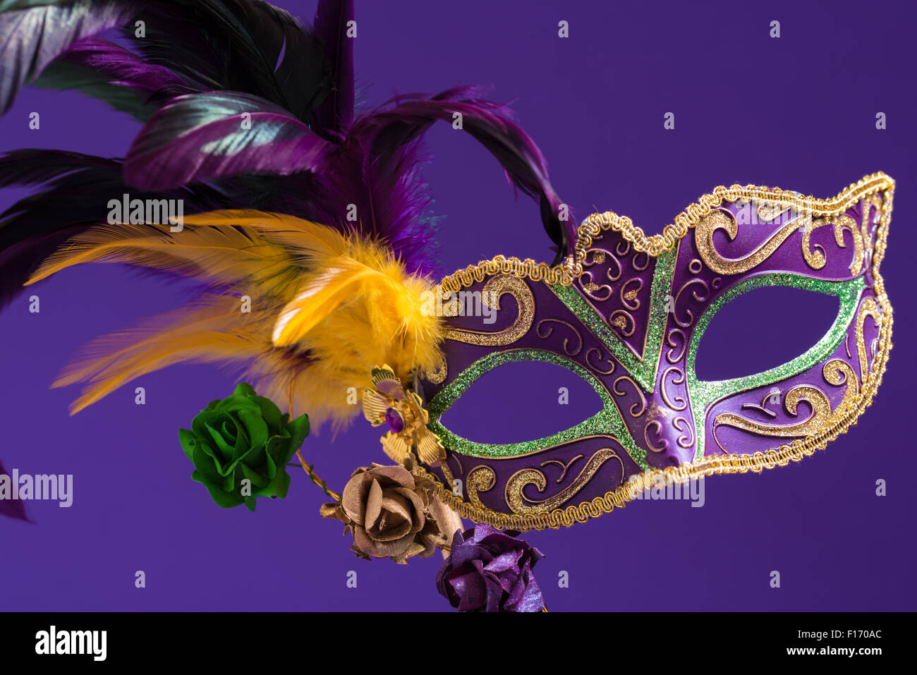 Mardi Gras or carnival mask on bright purple background Stock Photo - Alamy