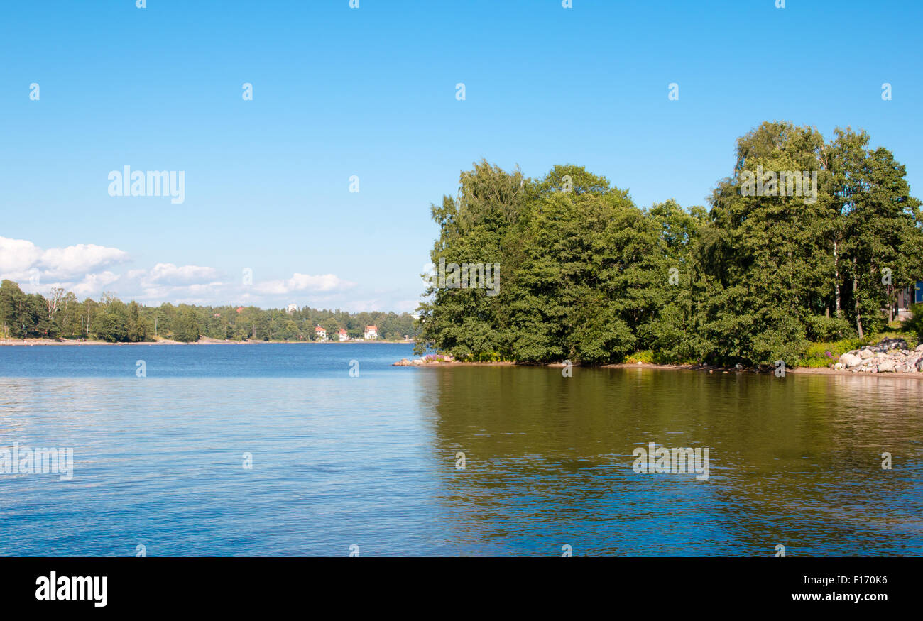 Coastline of Helsinki city during sunny summer day. Deep blue sky. Stock Photo