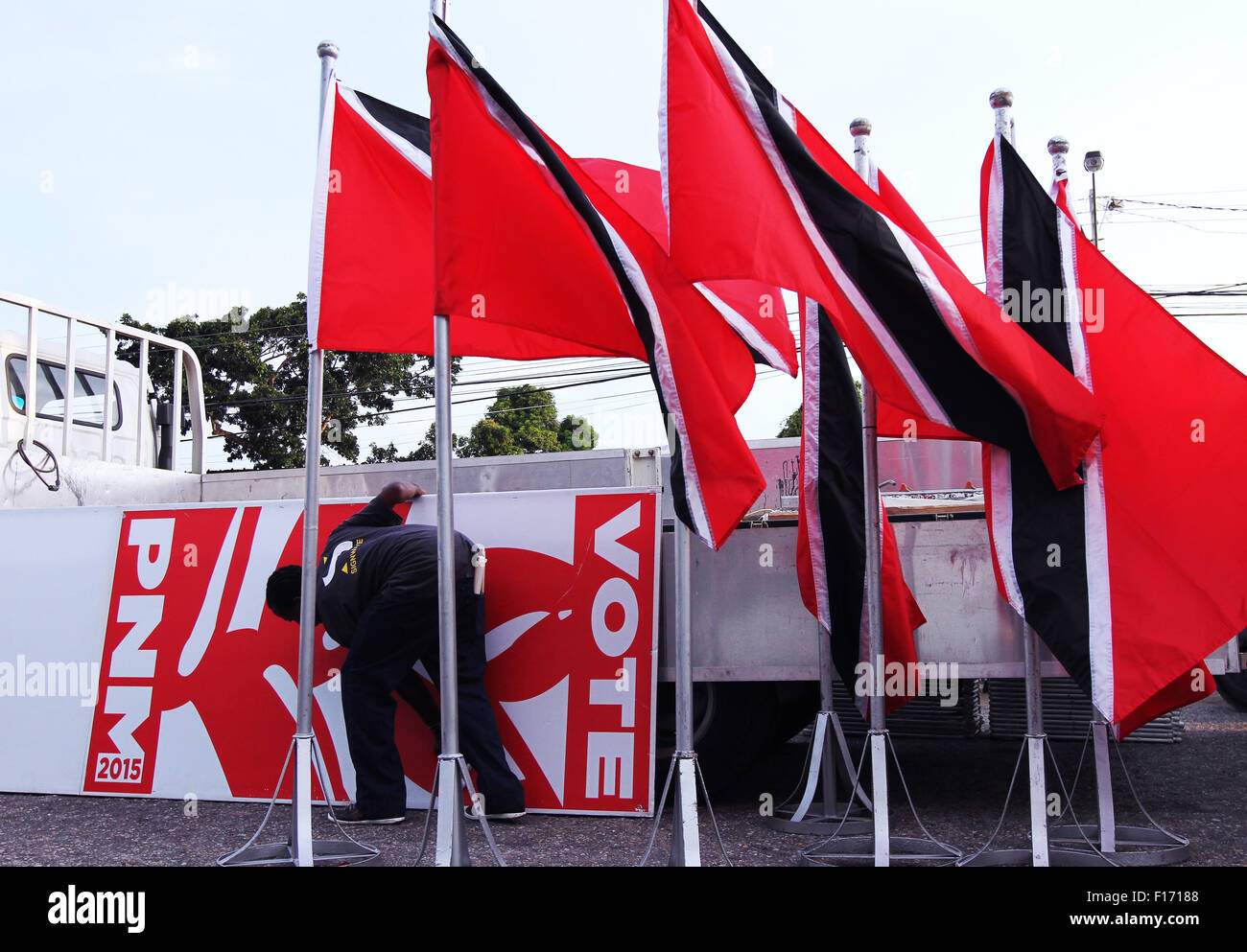 St. Augustine, Trinidad and Tobago. 27th August, 2015. The logo of the PNM political party and national flag of Trinidad and Tobago are assembled to decorate a public rally as part of the General Elections campaign on August 27, 2015 in St Augustine, Trinidad.  Elections are held on September 07, 2015. Credit:  SEAN DRAKES/Alamy Live News Stock Photo