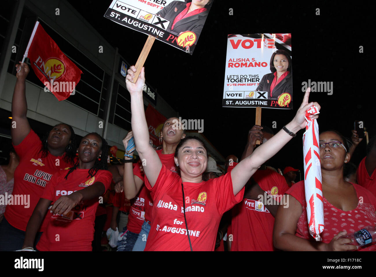 St. Augustine, Trinidad and Tobago. 27th August, 2015. Supporters of the People's National Movement (PNM) political party at a rally as part of the General Elections campaign on August 27, 2015 in St Augustine, Trinidad.  Dr. Rowley is the candidate of the PNM to be the next Prime Minister when elections are held on September 07, 2015. Credit:  SEAN DRAKES/Alamy Live News Stock Photo