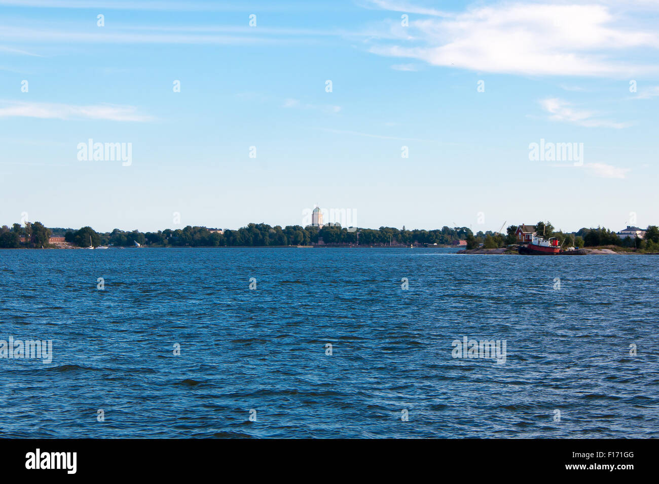 Coastline of Helsinki city during sunny summer day. Deep blue sky. Stock Photo