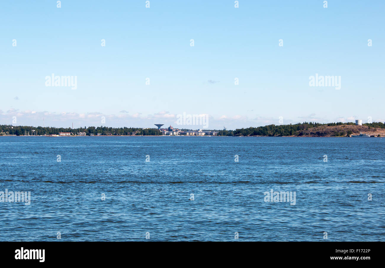 Coastline of Helsinki city during sunny summer day. Deep blue sky. Stock Photo