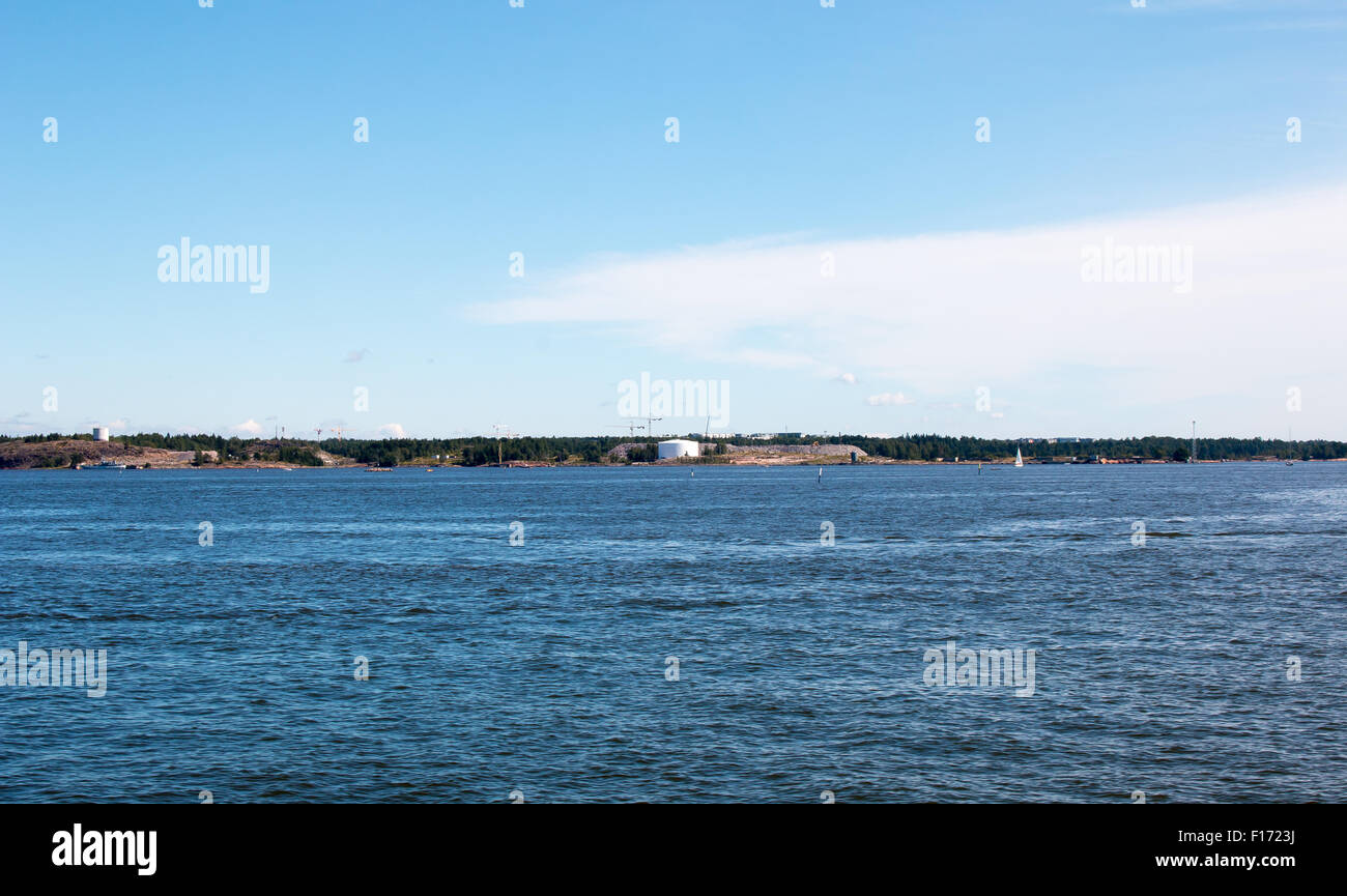 Coastline of Helsinki city during sunny summer day. Deep blue sky. Stock Photo