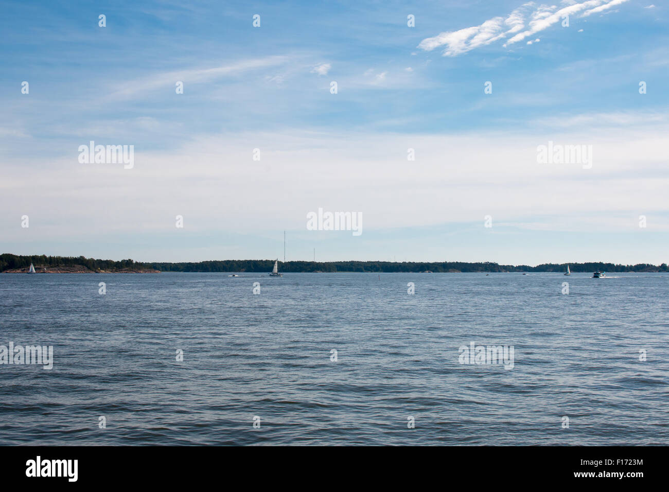 Coastline of Helsinki city during sunny summer day. Deep blue sky. Stock Photo