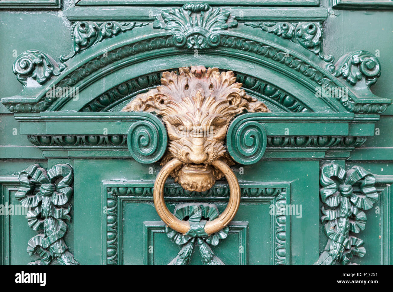 Lion door knocker and baroque decorations on door near Avenues Florida and Diagonal Norte in Buenos Aires, Argentina Stock Photo