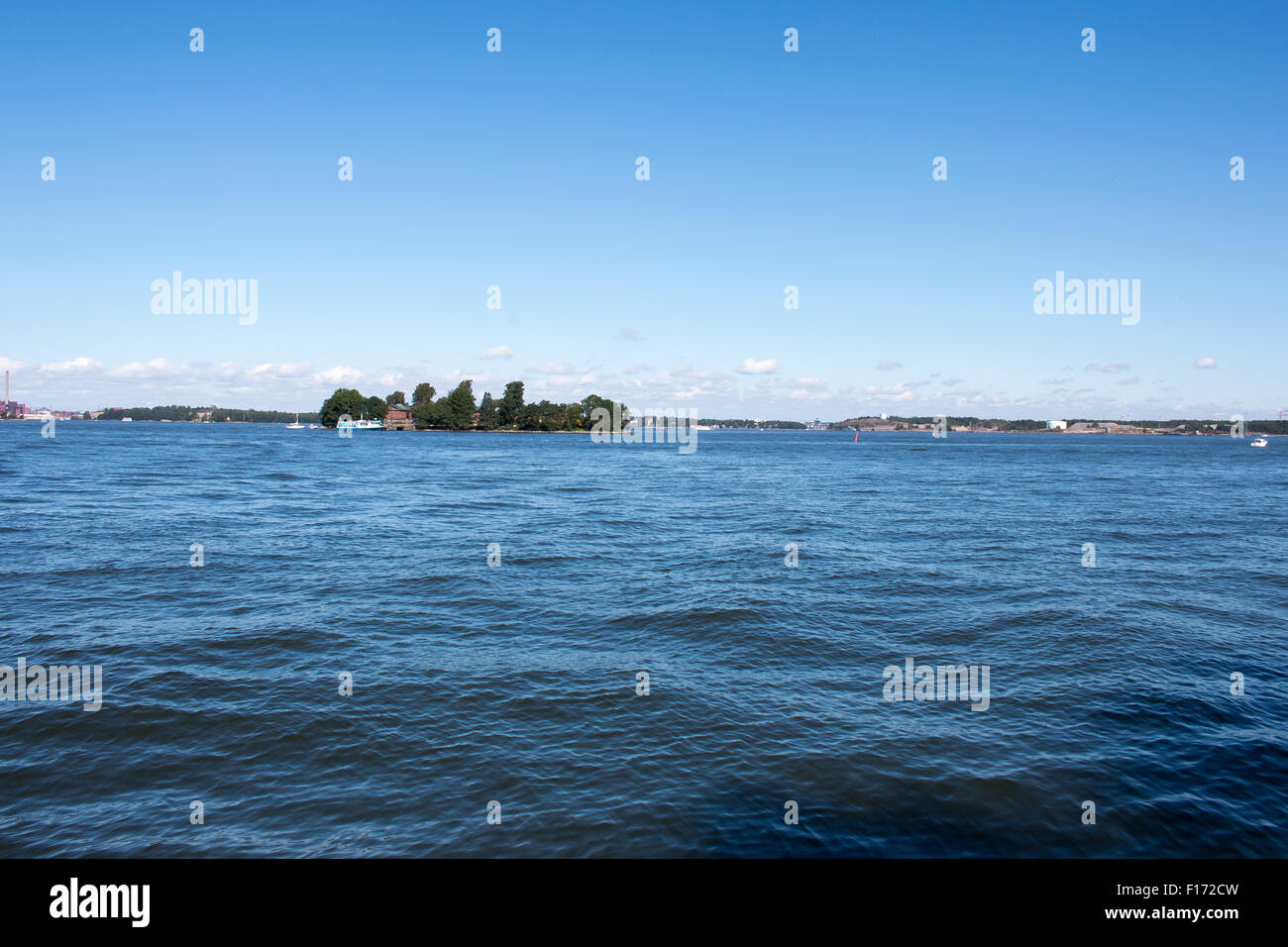 Coastline of Helsinki city during sunny summer day. Deep blue sky. Stock Photo